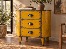 Load image into Gallery viewer, Commode en métal jaune à trois tiroirs posée contre un mur, vase et livres sur le dessus
