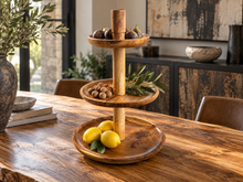 Charger l'image dans la galerie, Présentoir à trois plateaux en bois garni de fruits sur une table à dîner